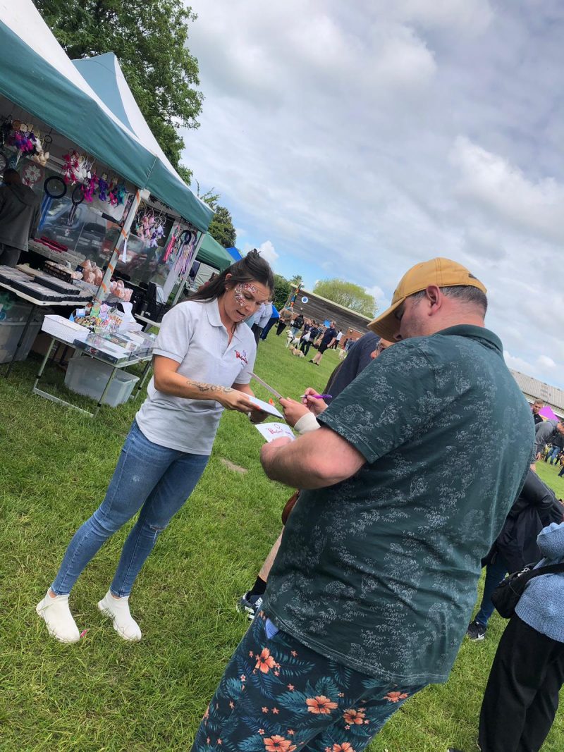 Handing out information for The Pawfect Retreat in Merseyside